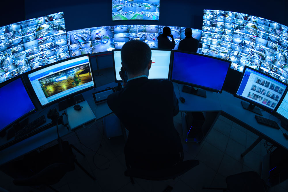 Cybersecurity threats monitored in high-tech security operations center.